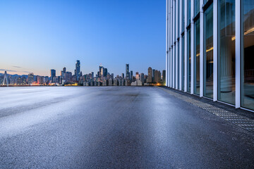 Asphalt road square and modern city buildings at night in Chongqing