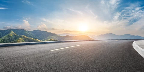 Fotobehang Grijs Asphalt highway road and green mountain with sky clouds at sunset  © ABCDstock