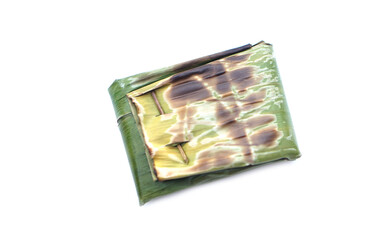 Food wrapped in toast banana leaf in rectangle shape, isolated on white background. Concept, using natural material that can be degraded to be packaging of food for safety. Traditional food, Cooking.