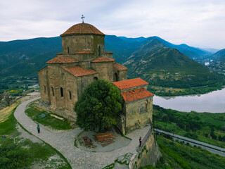 Fototapeta premium ancient Christian monastery in the mountains - aerial drone photo