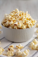 White Buttered Popcorn with Salt in a Bowl, side view.