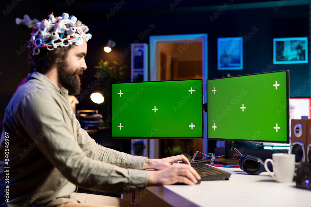 Poster neuroscientist using eeg headset and isolated screen multi monitor setup to upload mind into compute