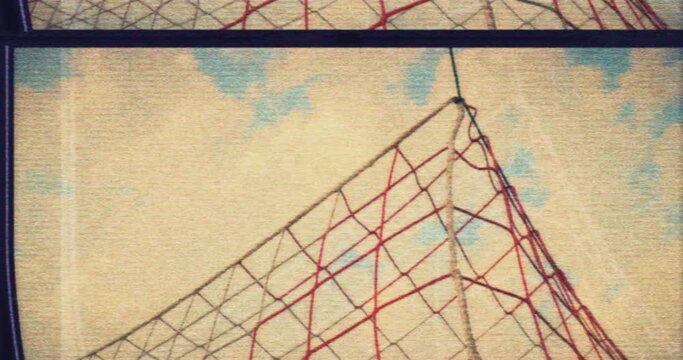 Soccer VHS - A low-angle slow motion, filmed from behind  the goal showing a soccer ball hitting the net and scoring a goal - retro style. Damaged VHS tape or faulty TV set - VFX