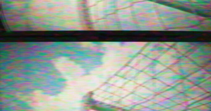Soccer VHS - A low-angle slow motion shot from the side of the goal showing a soccer ball hitting the net and scoring a goal - retro style. Damaged VHS tape or faulty TV set. - VFX