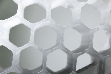 Honeycomb filter structure made of white plastic, close up