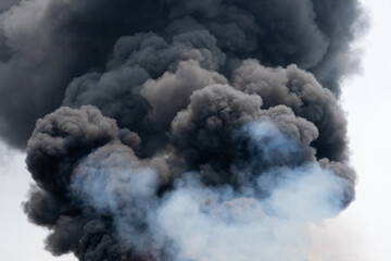 Black smoke caused by burning plastic from cause of fire industrial plant