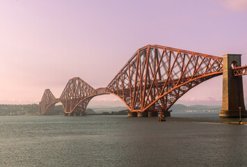 Fototapeta premium The iconic Forth Bridge, a cantilever railway bridge, spans the Firth of Forth west of central Edinburgh. Completed in 1890, it is a UNESCO World Heritage Site.