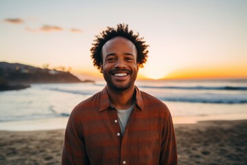Portrait of a joyful afro-american man in his 40s dressed in a warm wool sweater over stunning sunset beach background