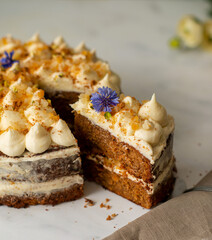 Vegan raw carrot cake on a white table. Healthy food. 