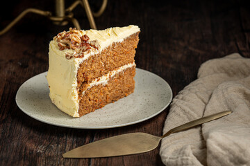 Walnut sponge cake with cream inside. Rustic background