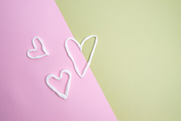 White hearts on a colored background. View from above. Copy space. concept postcard, valentine's day, birthday