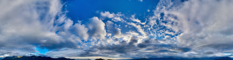 Aerial panorama Cloudscape of Canadian Mountain Landscape in Valley.