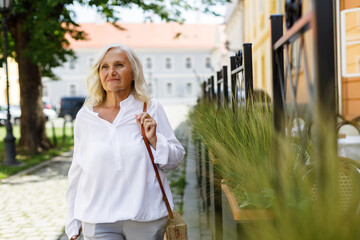 A woman with gray hair on the street