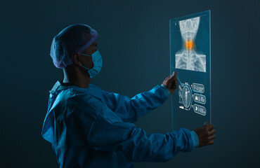 A doctor holding X-ray of painful neck Many others X-ray images in the hospital room. healthcare concept.