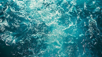 Obraz premium Turquoise Ocean Water Surface With White Foam