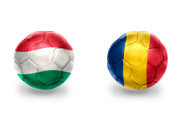 football balls with national flags of romania and hungary ,soccer teams. on the white background.