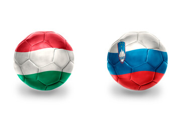 Obraz premium football balls with national flags of slovenia and hungary ,soccer teams. on the white background.