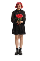 Full length portrait of a young woman in a black dress holding a bunch of red roses