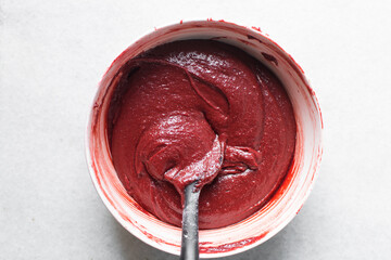 Overhead view  of red velvet brownie batter in mixing bowl, overhead view of red velvet fudge...