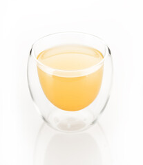 lemon ginger juice in glass isolated on white background. yellow drink