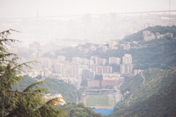 foggy Genova town, Italy, aerial view. Beautiful aerial view of Val Bisagno, Marassi district and football stadium, home of Genoa 