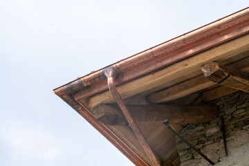 house roof, building renovation with copper gutter, precious metal, cornice front. incentives and the improvement of energy classes push the renovation market. © rikstock