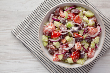 Homemade Chopped Mediterranean Salad in a Bowl, top view. Copy space.