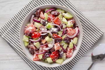 Homemade Chopped Mediterranean Salad in a Bowl, top view. Flat lay, overhead, from above.