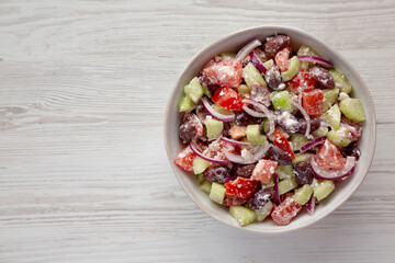 Homemade Chopped Mediterranean Salad in a Bowl, top view. Flat lay, overhead, from above. Copy space.