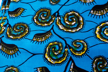 top view of blue ankara fabric, flatlay of nigerian wax cloth with designs, spread out blue ankara material