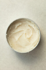 Luxurious, creamy body butter in a tin container, perfect for nourishing and hydrating your skin. This rich, whipped moisturizer is ideal for self-care routines, leaving your skin smooth and rejuvenat