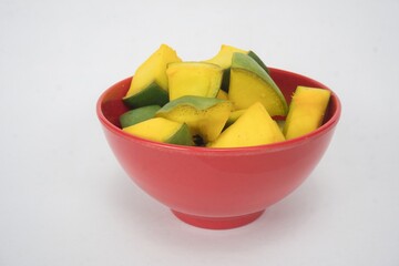 Slices of Mango for Mango Pickle In Red Bowl, Isolated On White Background