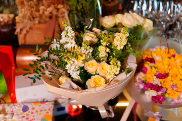 A large beautiful tender bouquet on the background of a bar. A traditional gift for a woman on a holiday.