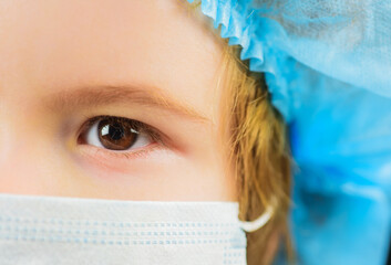 Cropped portrait of little sick child in protective mask. Face mask against virus, ill, epidemic,...