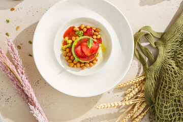 Elegant Lime, Mint, and Strawberry Mousse Pastry on White Plate with Natural Elements