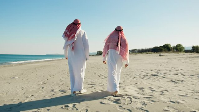 Two Sheiks Taking A Walk To Discuss About Business
