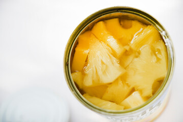 Canned pineapples in a tin can.