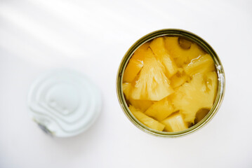 Canned pineapples in a tin can.
