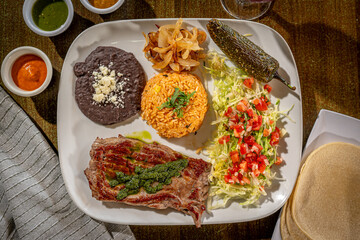 Carne Asada - with Mexican rice, refried pinto beans, and chile toreado. Salsa verde, salsa brava and salsa habanero with Sangria
