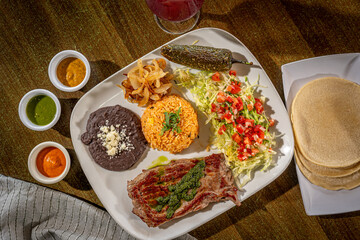 Carne Asada - with Mexican rice, refried pinto beans, and chile toreado. Salsa verde, salsa brava and salsa habanero with Sangria
