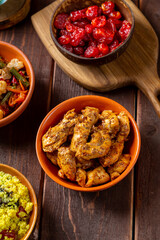 Traditional lunch couscous with chofruits, vegetables, chicken in sauce and dried fruits
