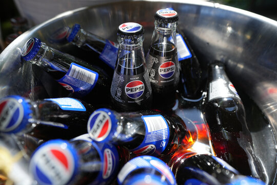 Bucharest, Romania 1 June 2024. Pepsi bottles on ice. concept for party.