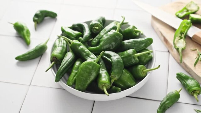 Fresh green Spanish Pimientos de Padron pepper or jalapeno, green bell pepper, stock video footage 4k