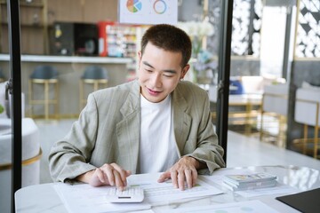 Fototapeta premium Confident asian business man Auditor or internal revenue service staff checking annual financial statements company Audit &nbsp;Accounting tax