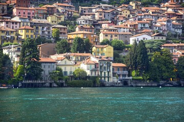 Fototapeta premium View of a typical village surrounded by Lake Como, Italy. Popular tourist destination.