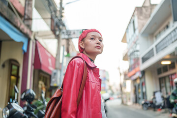 Gen z girl leather fashion with punk Asian woman tourist of local city Southeast Asia travel trendy...