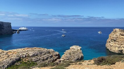 Boats sailing on the Mediterranean sea, between Comino and Malta islands. High quality 4k footage