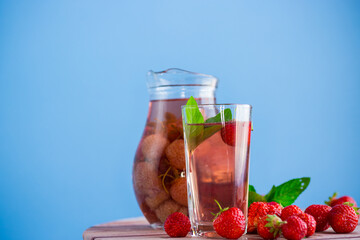 Sweet refreshing berry compote of ripe strawberries in a decanter