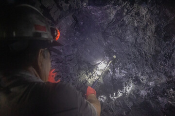 miner man picking in the mine 