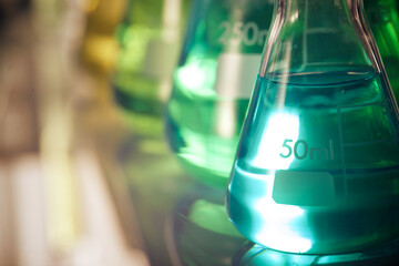 Glass flasks placed in a laboratory table